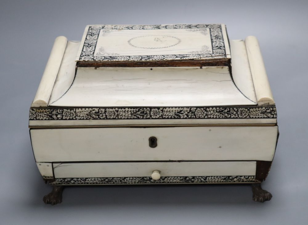 An early 19th century Anglo-Indian Vizagapatam dressing table box, of sarcophagus form, with lion paw feet, width 27cm